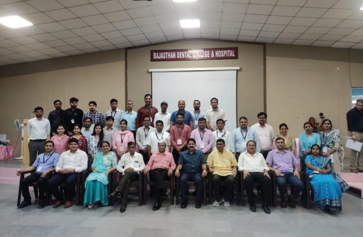 Group photograph with participants and institutional leaders at Rajasthan Dental College & Hospital.