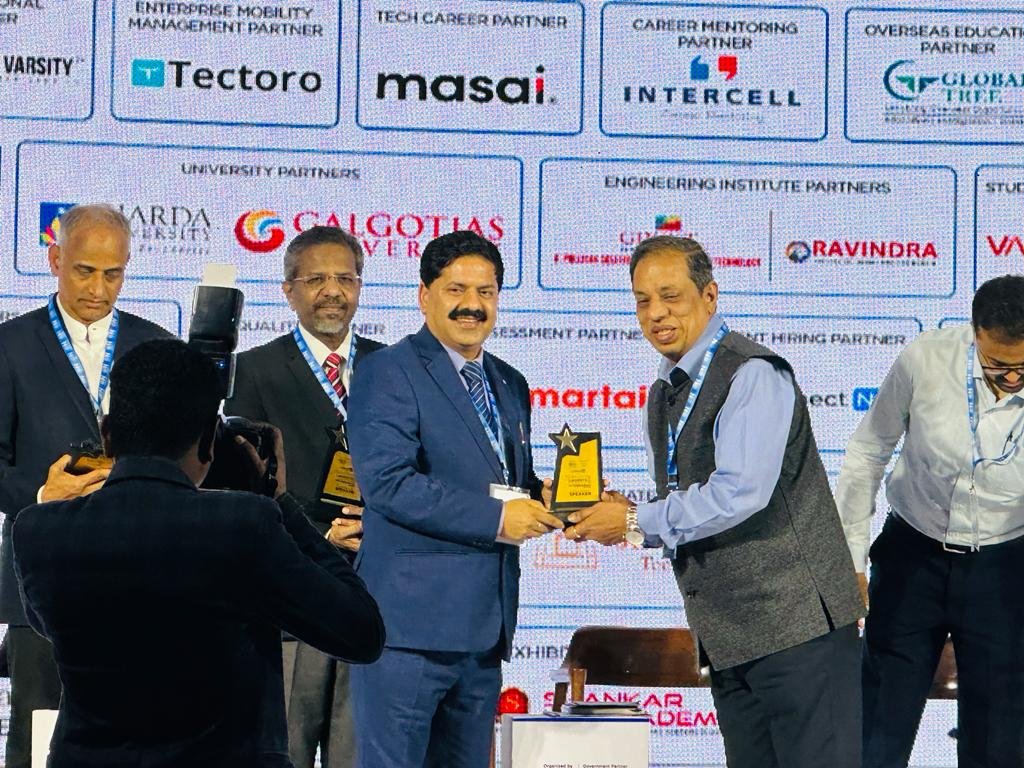 Prof. (Dr.) Mridul Dharwal receiving recognition at the Education Leaders Conclave & Awards.